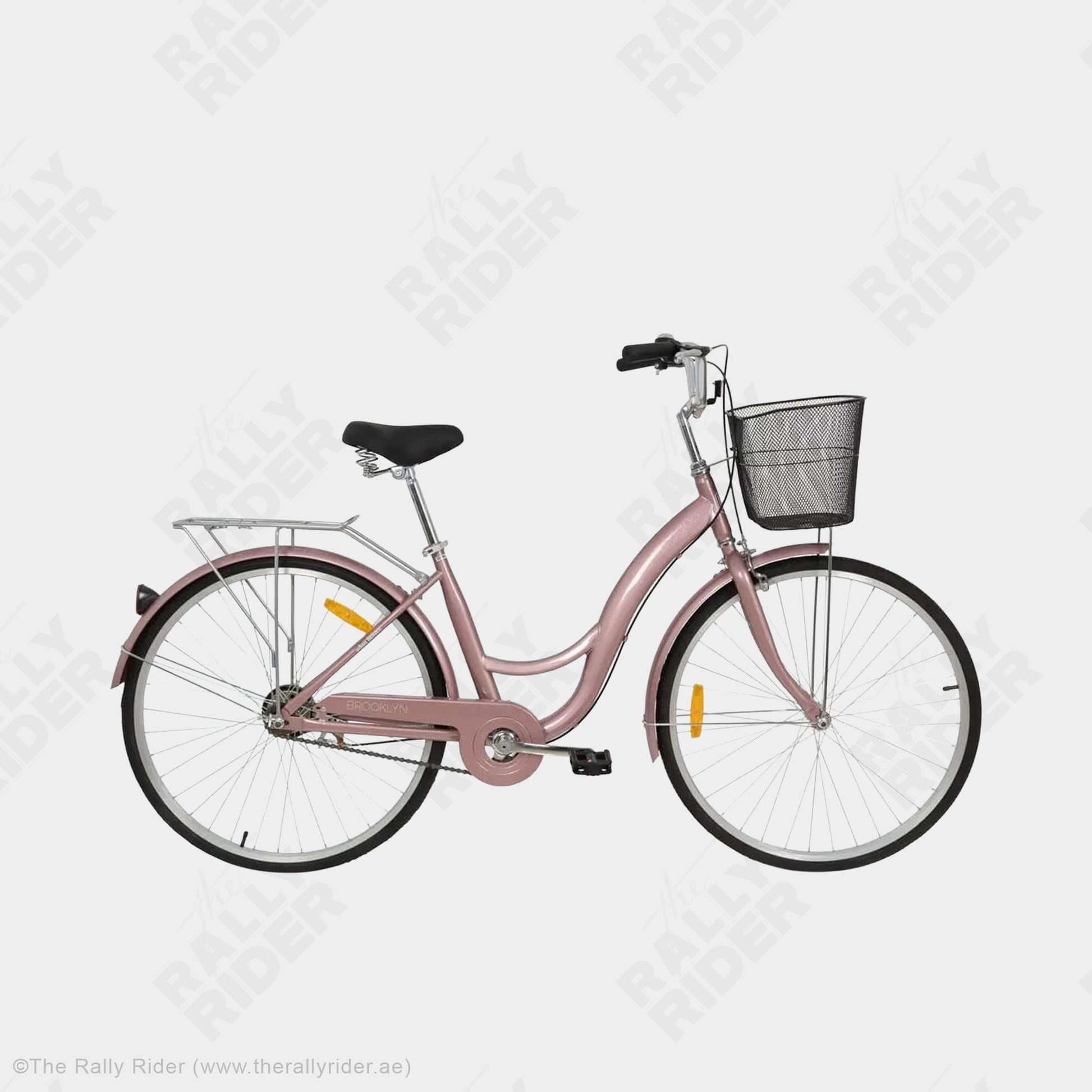 Mogoo Brooklyn city bike in rose gold with front basket, full fenders, and spring-loaded comfort saddle